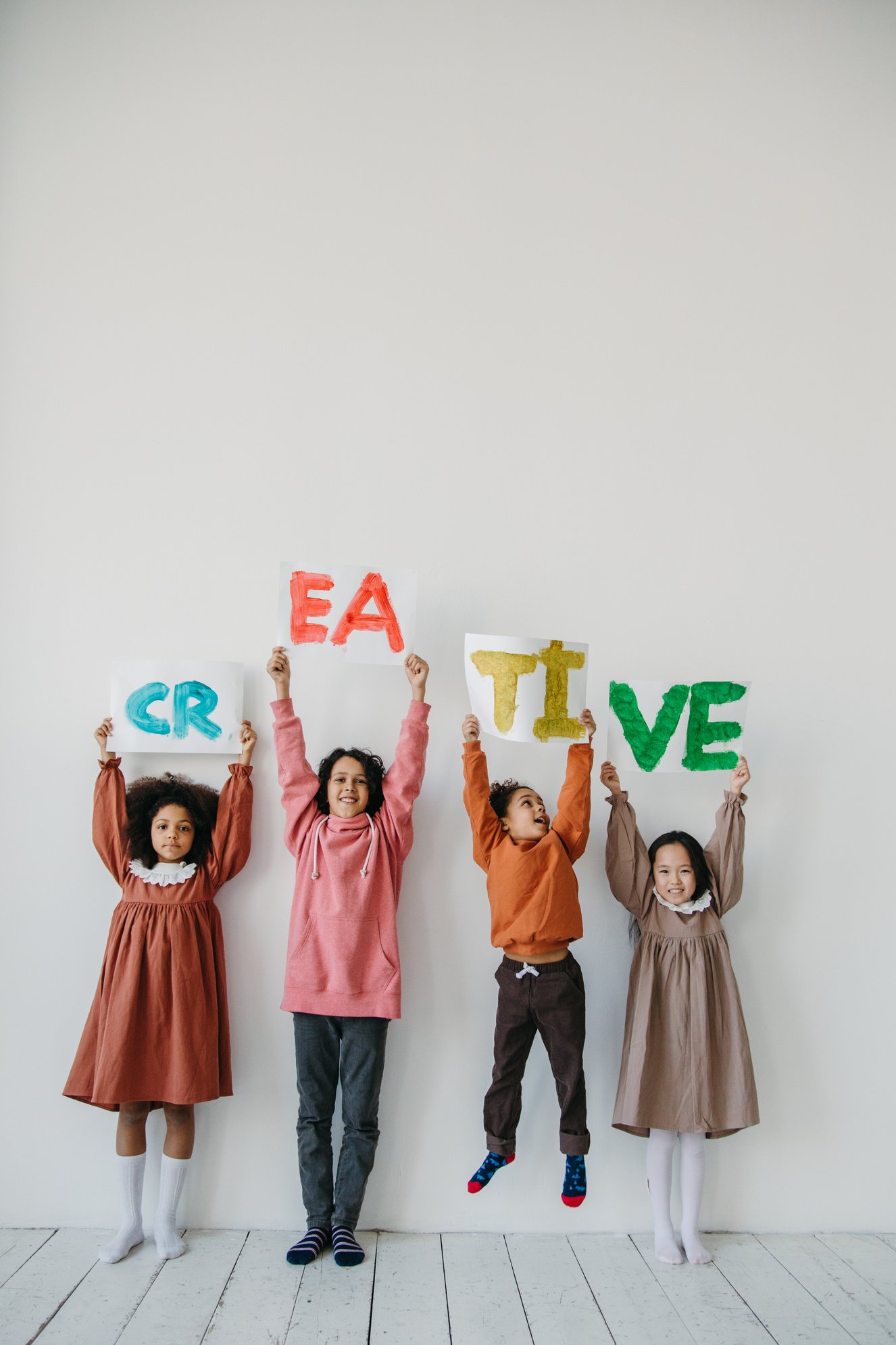 Kids Holding Papers